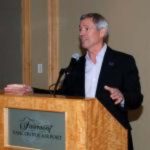 Clia Alaska President John Binkley speaks at a lectern