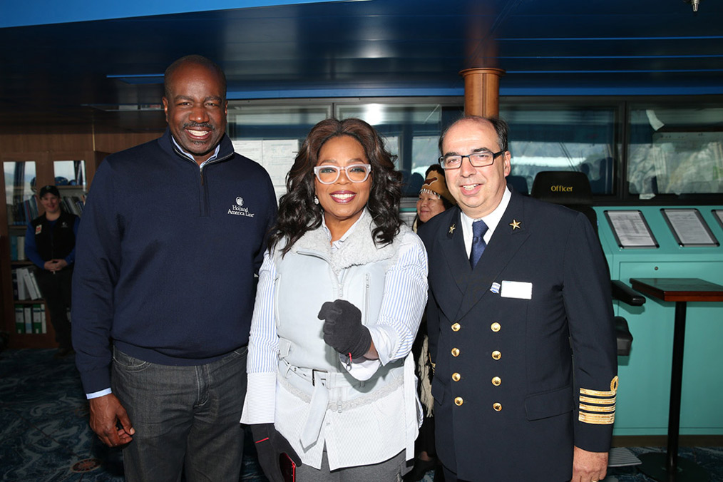 Holland America President Orlando Ashford and Eurodam Captain show Oprah around the bridge.
